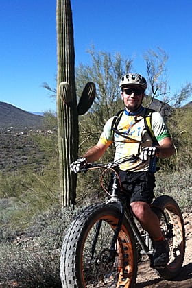 Garret Topham a GIS specialist shows his Esri bike jersey