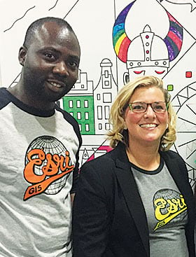 Paul Ajayi and Jessica Leonard students model their Esri T-shirts