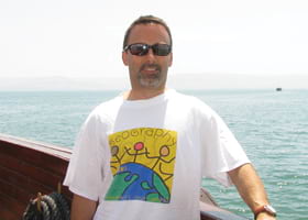 Ray Postolovski, US topo production manager wore his Esri shirt while sailing the Sea of Galilee off the shores of Tiberias, Israel