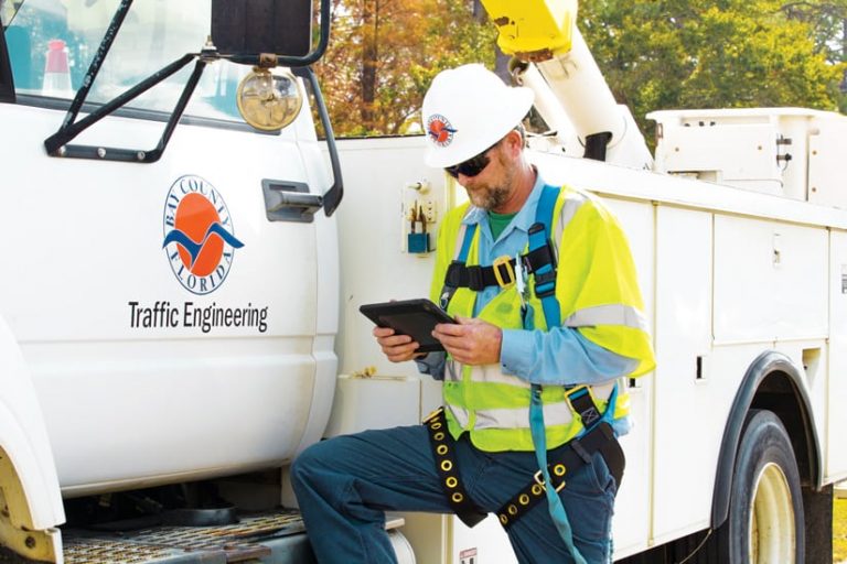 A Bay County fieldworker using a mobile device A Bay County fieldworker using a mobile device