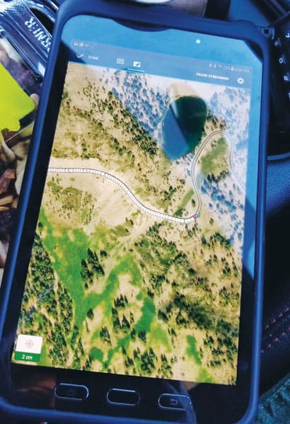 A Samsung tablet showing the new road map on satellite imagery