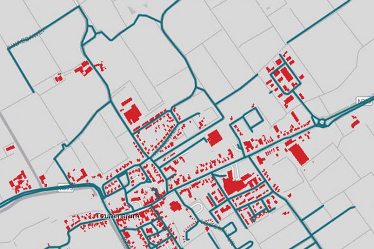 A map with some streets highlighted in blue and some buildings highlighted in red A map with some streets highlighted in blue and some buildings highlighted in red