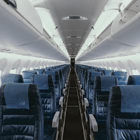 An airplane with empty seats signals a decline in business travel