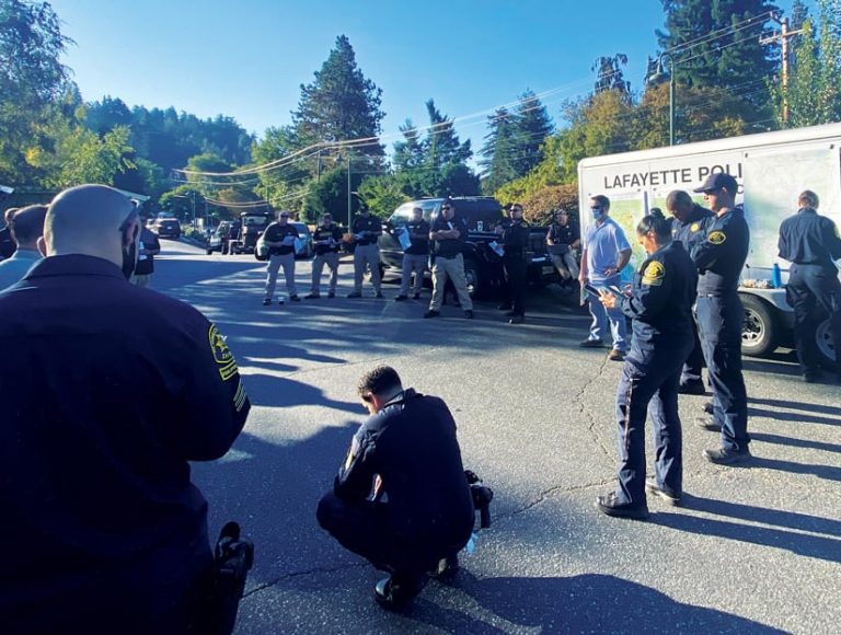 Group of GeoAcuity staff and law enforcement stand in a socially distanced circle Group of GeoAcuity staff and law enforcement stand in a socially distanced circle