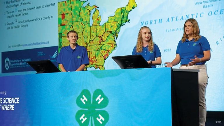 Three students from the Tennessee 4-H GIS team present on stage at the 2017 Esri User Conference Plenary Session