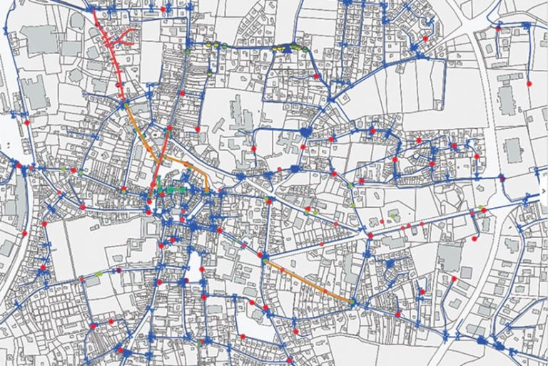 A black-and-white map with blue, red, and orange lines and dots on it