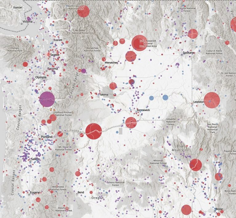 A light gray map with Yakima, Washington, in the middle showing dams of various sizes in red and pink dots