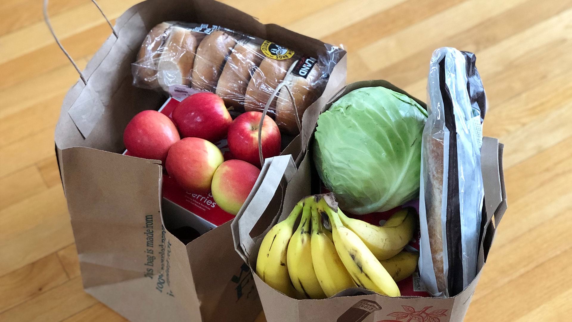 An office grocery delivery waiting to be unbagged