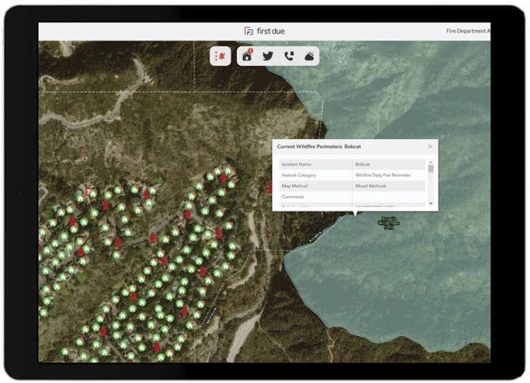 A tablet displaying imagery of a hillside with pinpoints that identify houses and fire hydrants and the area of the nearby Bobcat Fire highlighted in blue; a pop-up has information about the wildfire’s perimeter