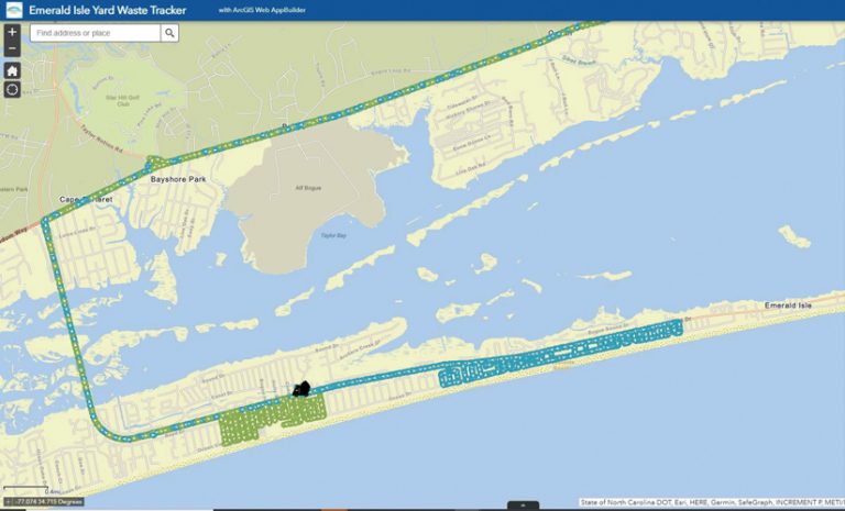 A map showing the tracks of two yard waste trucks—in blue and green—for their pickups along Emerald Isle and their trips to the landfill A map showing the tracks of two yard waste trucks—in blue and green—for their pickups along Emerald Isle and their trips to the landfill