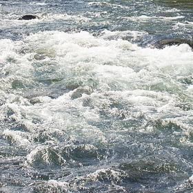A rushing river with whitewater