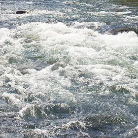 A rushing river with whitewater A rushing river with whitewater