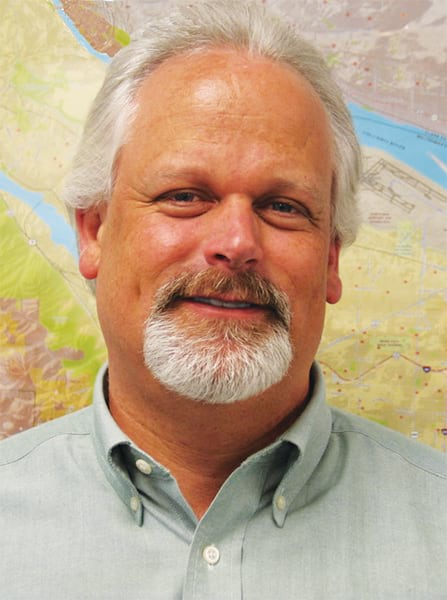 A headshot of John Cassidy