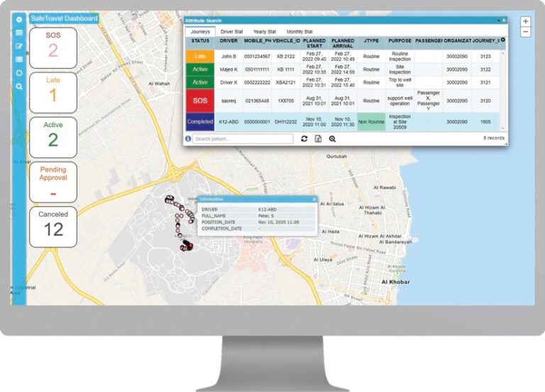 A desktop computer showing a map that pinpoints various vehicle locations with a pop-up displaying information about a few vehicles