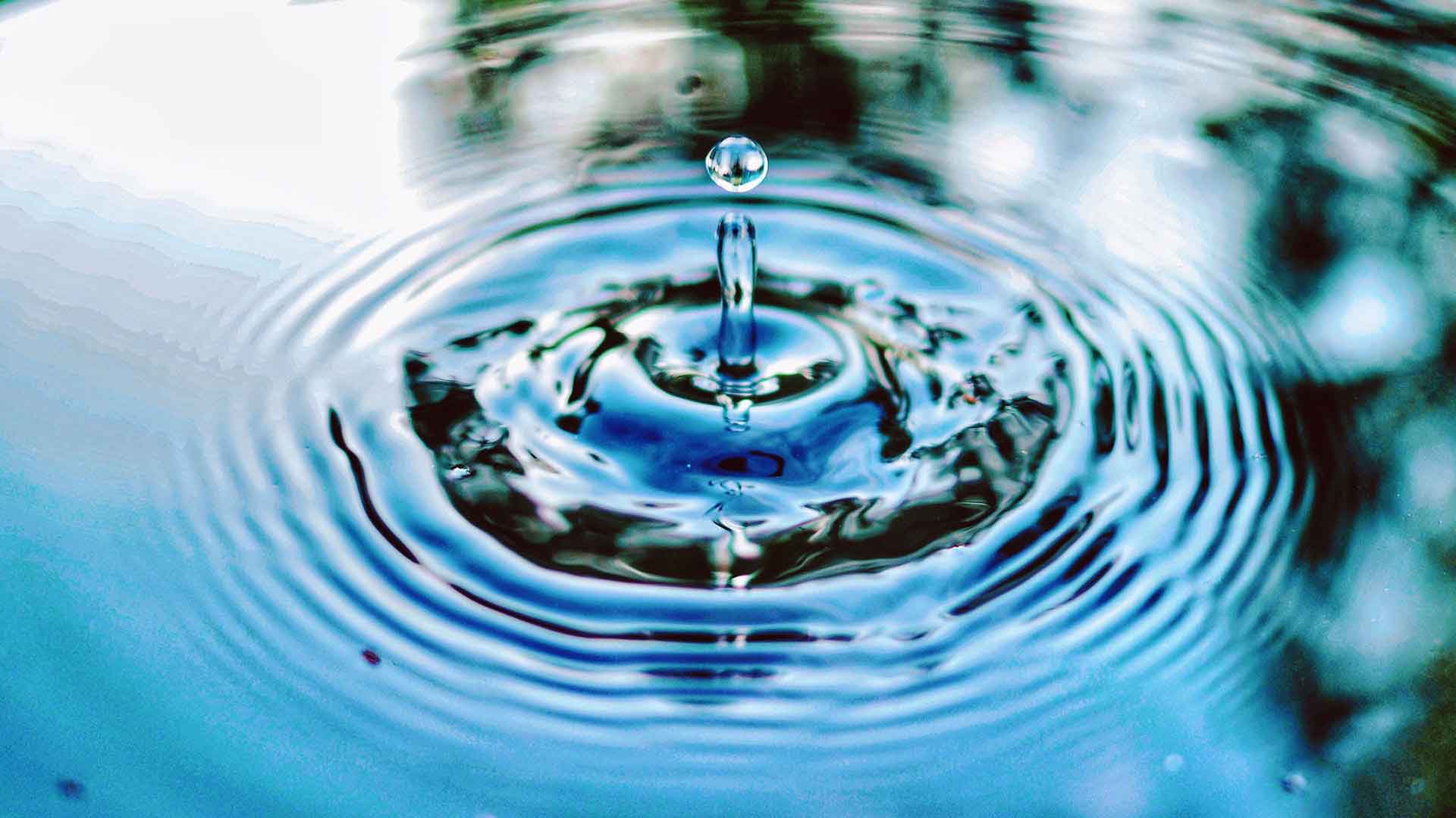 A drop of water in a pond and the ripples it creates signifies the importance of water management