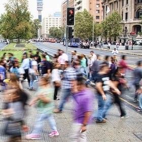 people crossing a street in a South American city