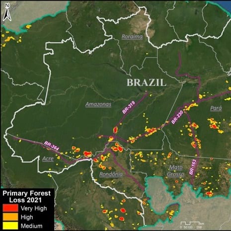 A mostly green map of Brazil speckled with red and yellow dots representing forest loss
