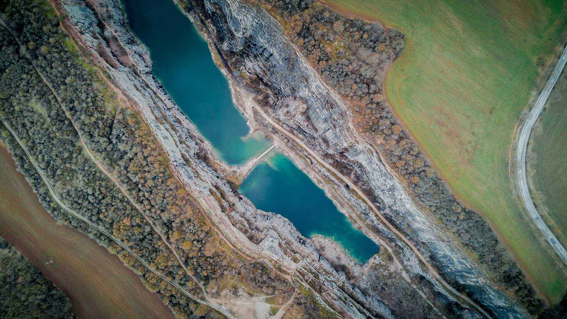 This quarry with its retention pool is an example of a natural resources company\'s work