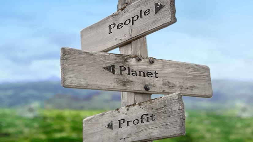 A signpost pointing to people, profit, and planet