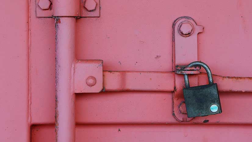 A locked pink shipping container