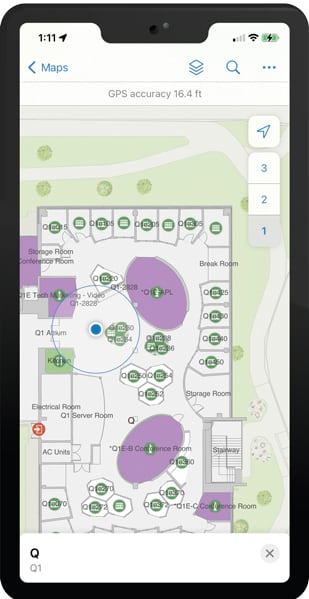 A map of an office building—identifying offices, desks, stairways, and exits—displayed on a smartphone screen
