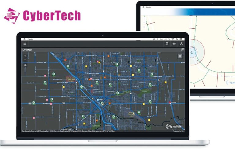 A laptop showing a live map of a city next to a table showing a different map with the CyberTech logo