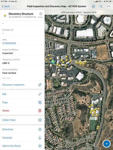 An aerial image of Carlsbad with yellow stars on various buildings and information about one post-construction BMP on the left side of the screen