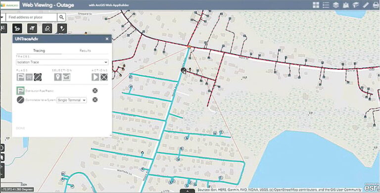 A gray map of an area with utility lines drawn in light blue and red