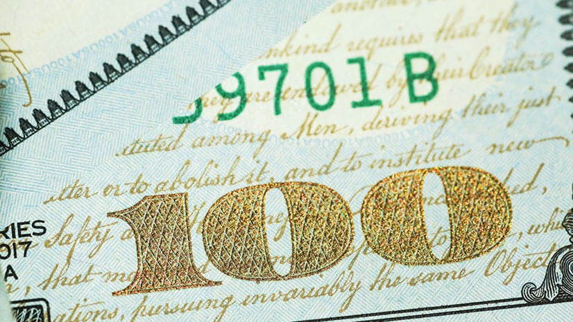 a one hundred dollar US bill signifies the IRA and federal spending