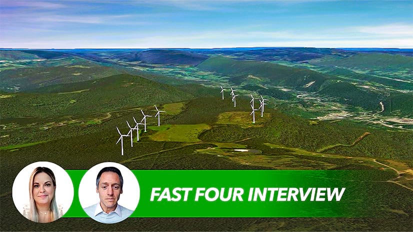 Twelve wind turbines generate renewable energy in a hilly area