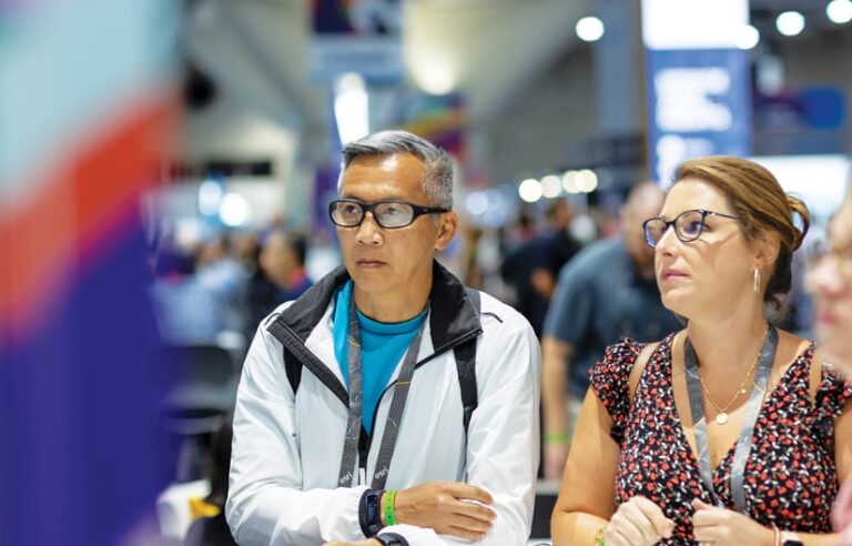 A man and a woman looking at a display