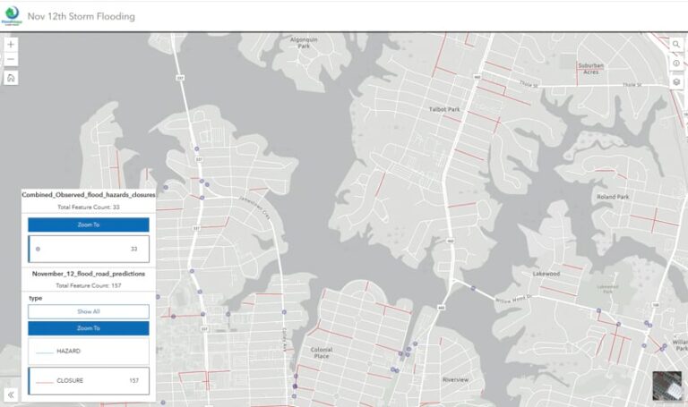 A gray road map with some roads highlighted in red and an information box with road flooding prediction data in it