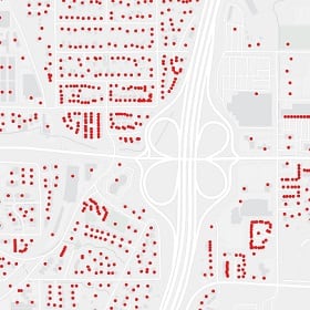 A map with red dots indicating hundreds of households