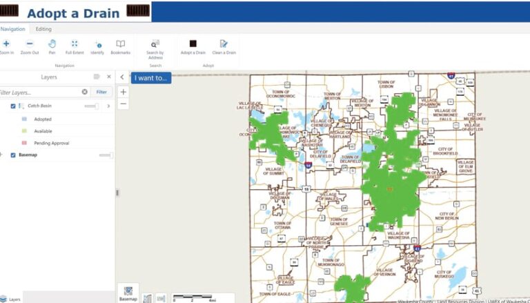 The Adopt a Drain web app interface, which shows a map of Waukesha, WI, with green icons on it showing which drains have been adopted, plus a menu that allows users to filter layers according to which drains have been adopted, are pending approval, and are available