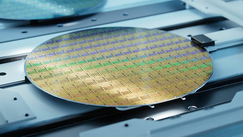 A gold wafer shows semiconductor production