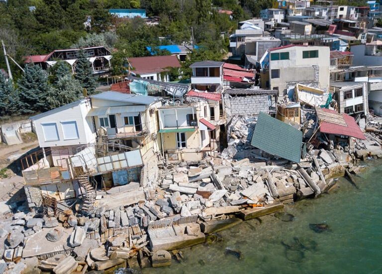 Houses near water that were damaged in a hurricane