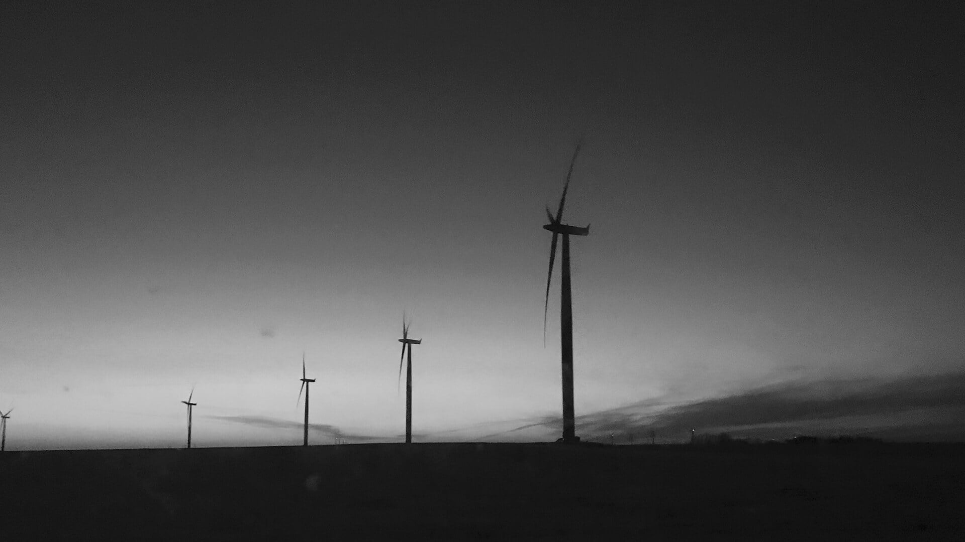 Wind turbines signify the work of NextEra Energy and other renewable energy providers