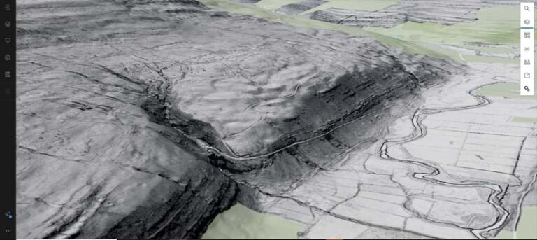 A 3D view of a lidar image of a hilly area next to a valley and a river