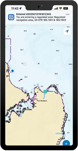 An Electronic Navigation Chart, shown on a smartphone, that indicates where a vessel is and that the vessel has entered a regulated area