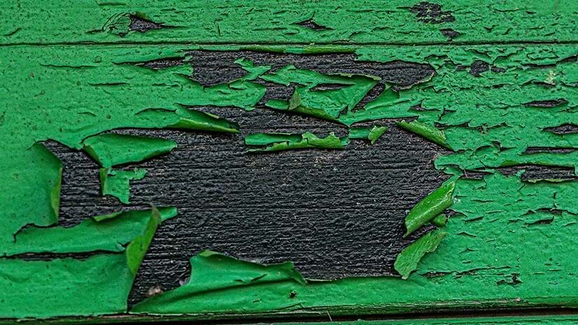 Greenwashing, symbolized by chipping green paint
