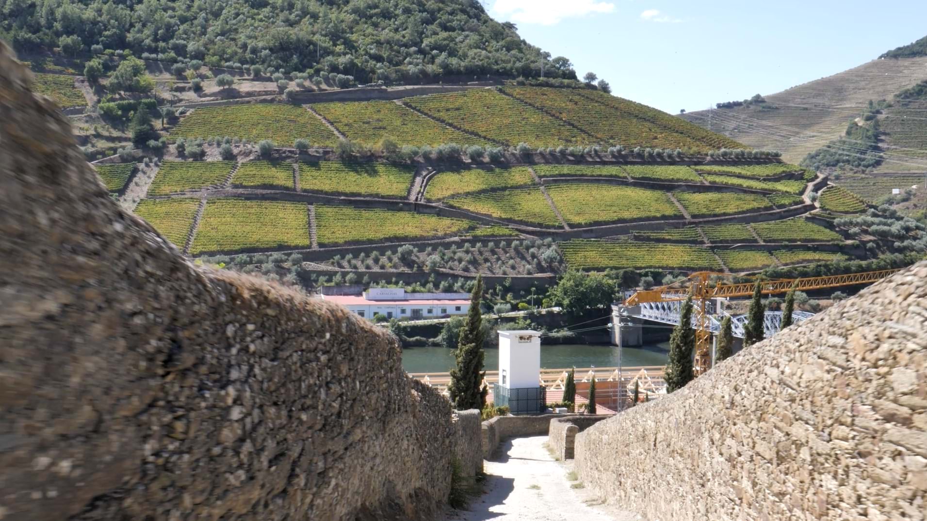 A winery with steep hills and a cobblestone walls