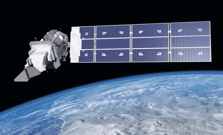 A satellite with solar panels floats above the planet Earth.