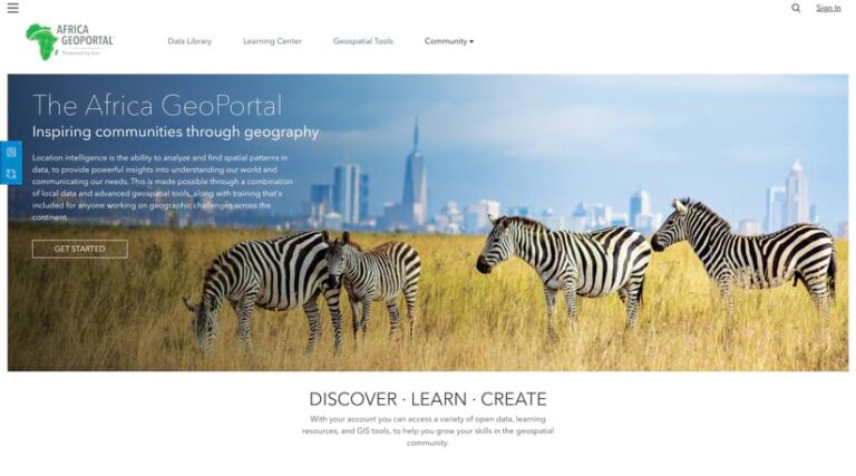 The Africa GeoPortal homepage showing three zebras grazing in tall, dry grass with the skyline of a modern city rising in the background against a blue sky. The Africa GeoPortal homepage showing three zebras grazing in tall, dry grass with the skyline of a modern city rising in the background against a blue sky.