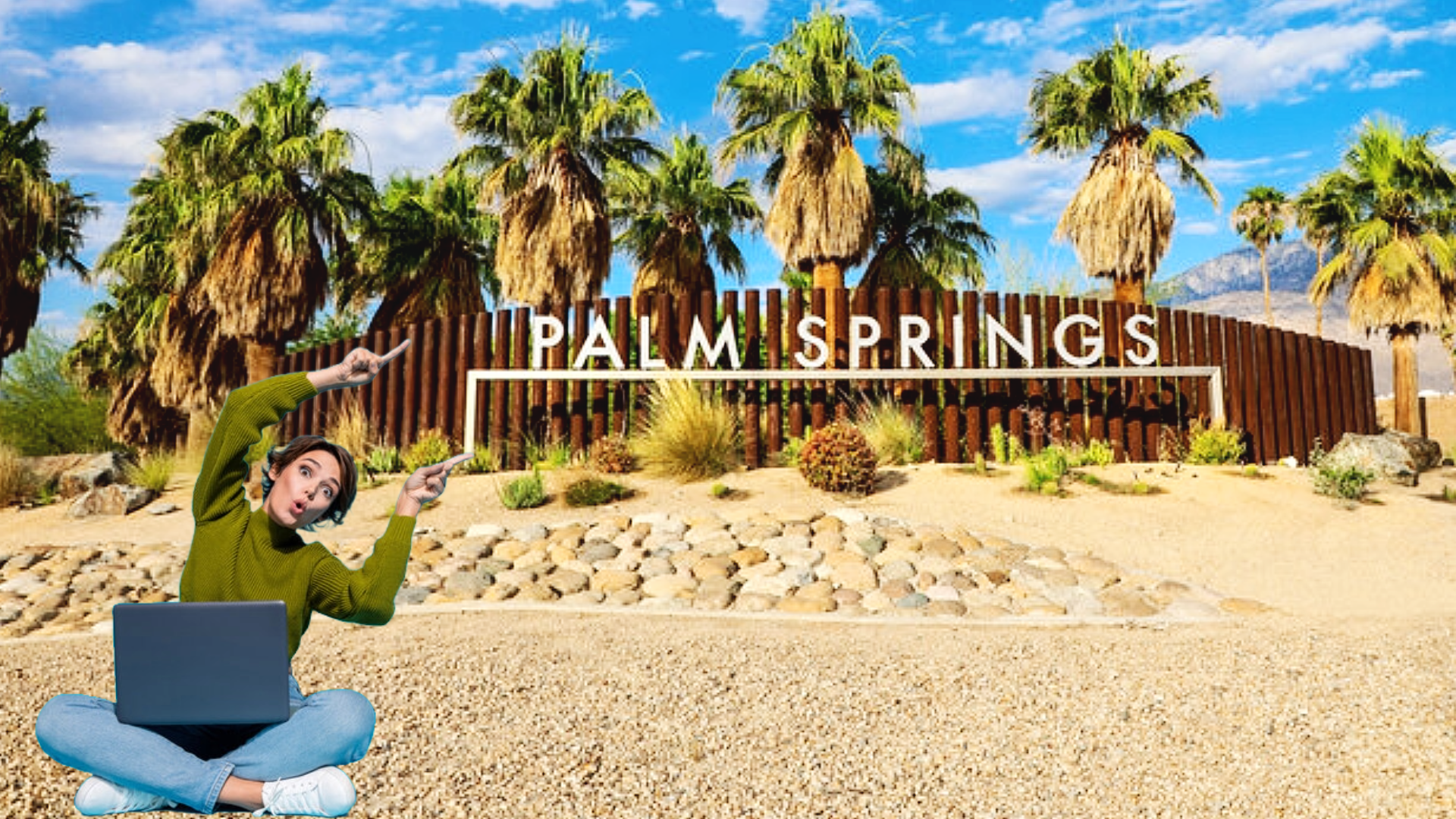 A woman points excitedly at a Palm Springs sign while seated with a laptop on the ground.