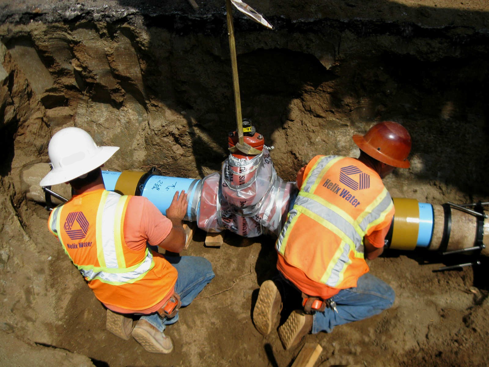 field crews installing a new segment of PVC water main
