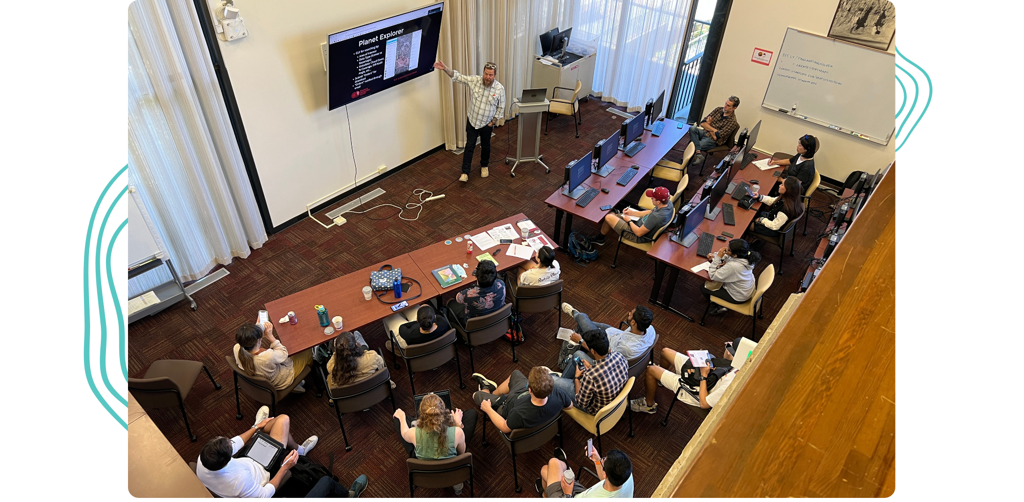A view of David and Stace providing a workshop to a group of students