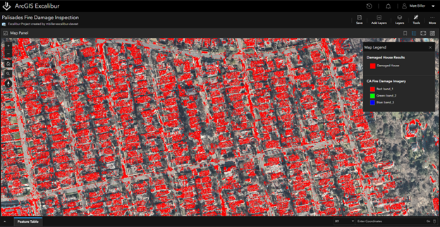Satellite mage of a city with buildings outlined in red.