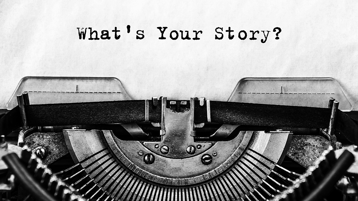 A sheet in a typewriter that says what's your story?
