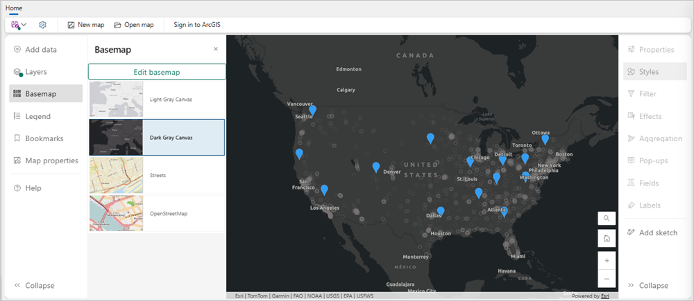 Dark grey map of the United States with blue pins.