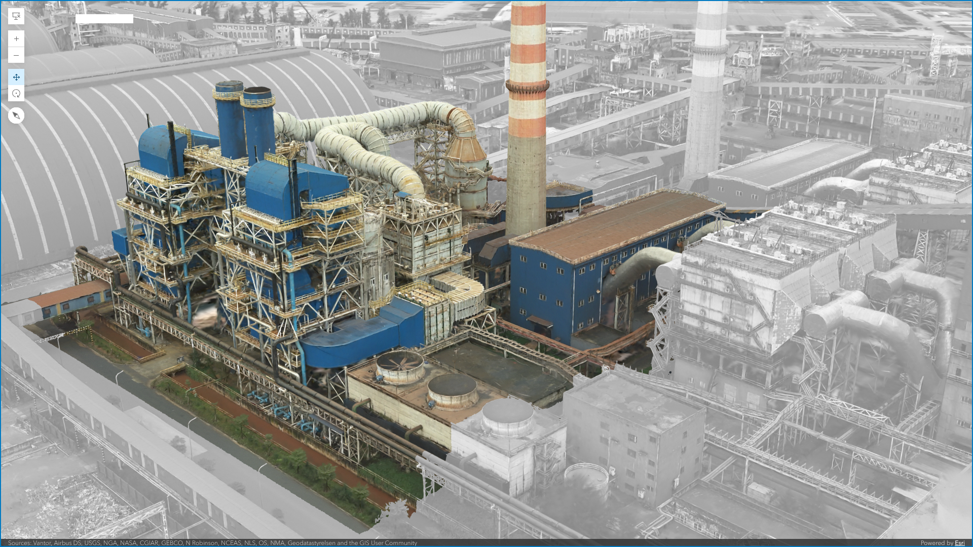 Photorealistic 3D view of an industrial facility shown as Gaussian splats, highlighting detailed pipes, steel structures, buildings, and smokestacks, with surrounding context faded for contrast in Scene Viewer.